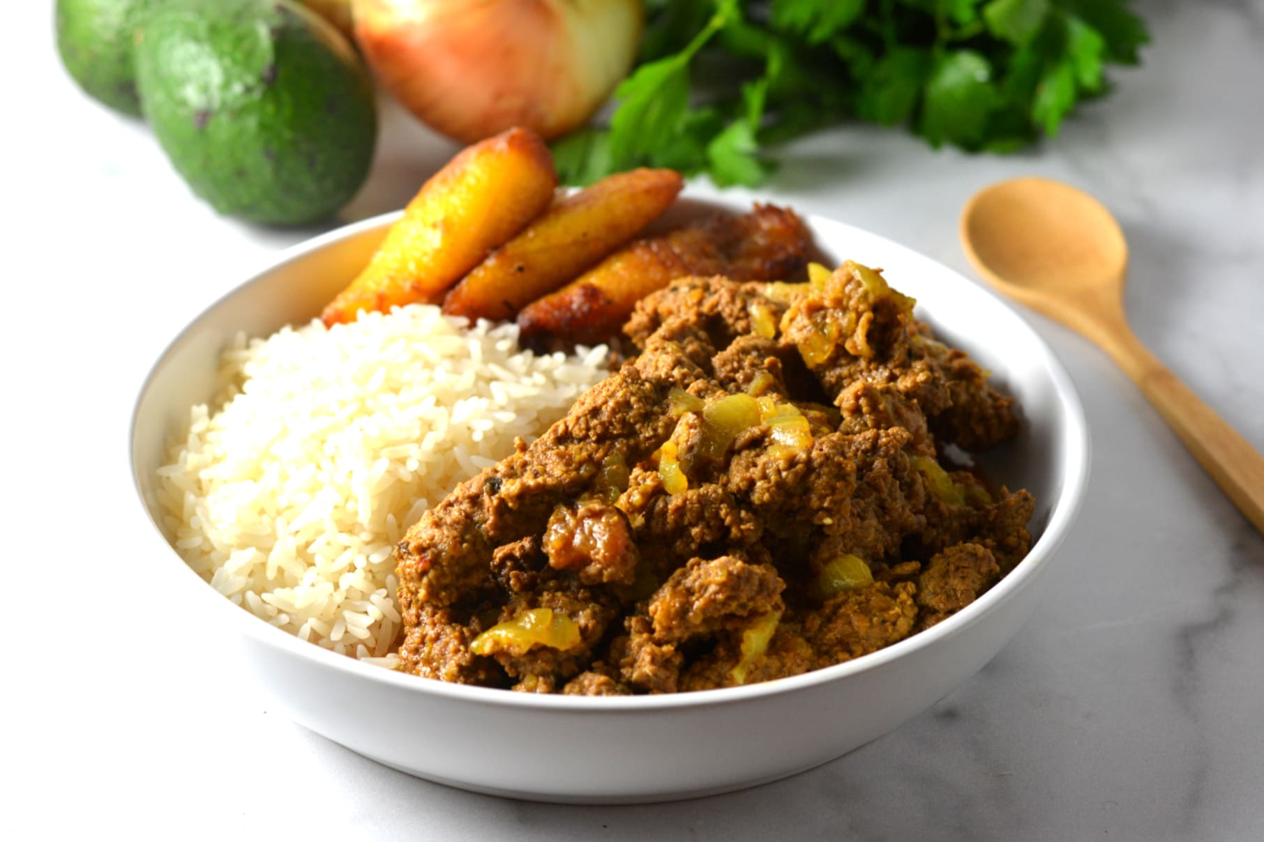 Bisctec encebollado is a traditional Puerto Rican beef stew that's pur...